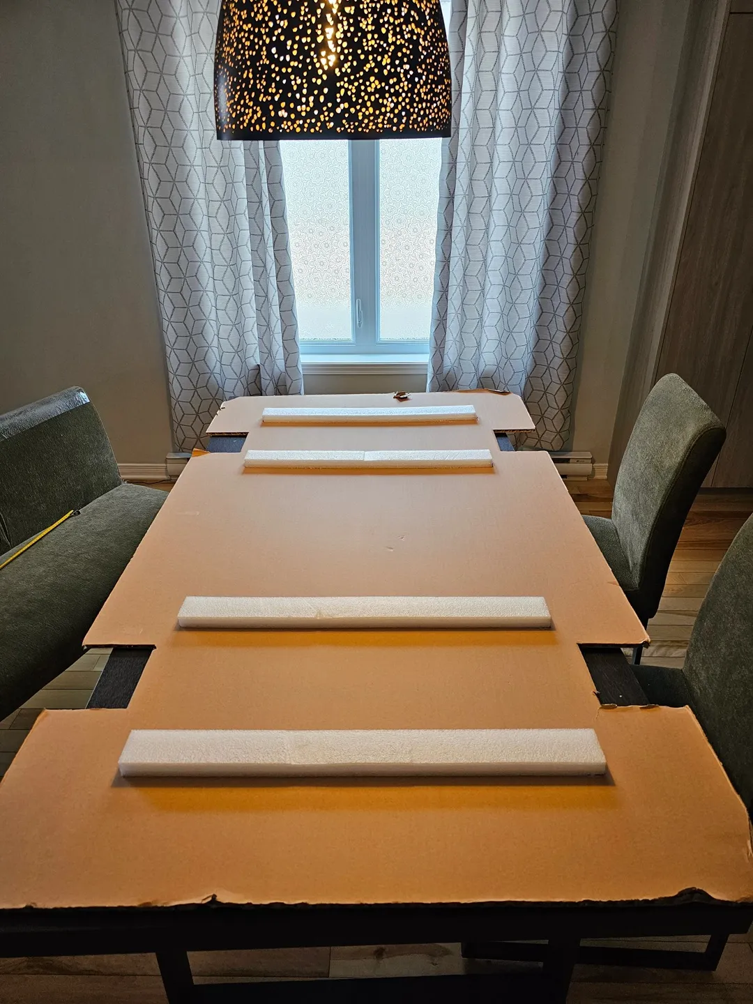 Large cardboard piece serving as the base for the arrow